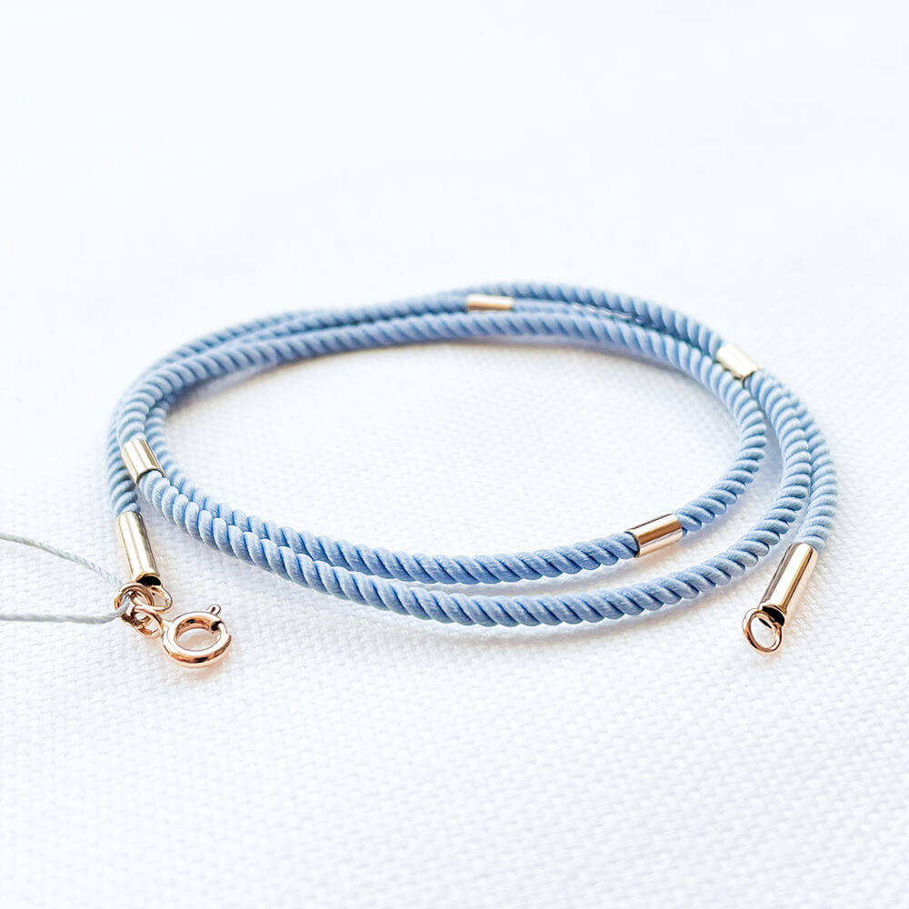 Шовковий блакитний шнурок з 4 золотими вставками. Артикул: 004866