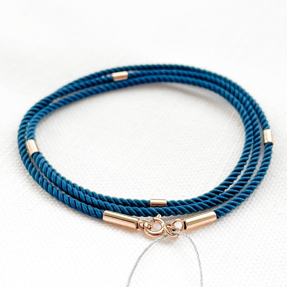 Синий шелковый ювелирный шнурок 2мм с золотыми вставками. Артикул: 004033